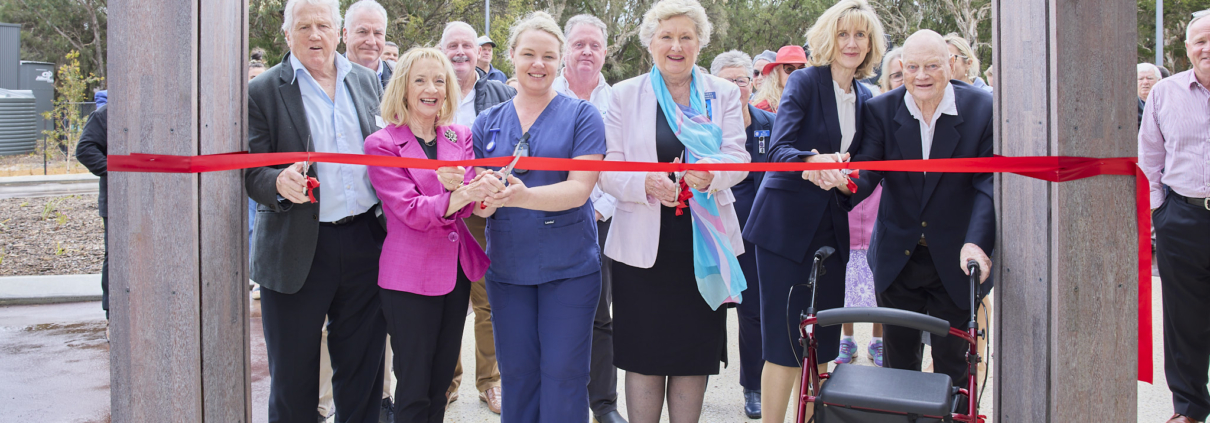 people cutting ribbon