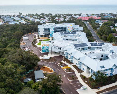 aerial image of building and location by the ocean