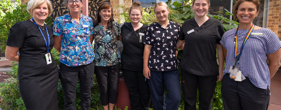 A group of aged care staff smiling