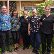 A group of aged care staff smiling