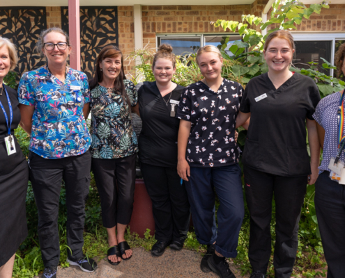 A group of aged care staff smiling
