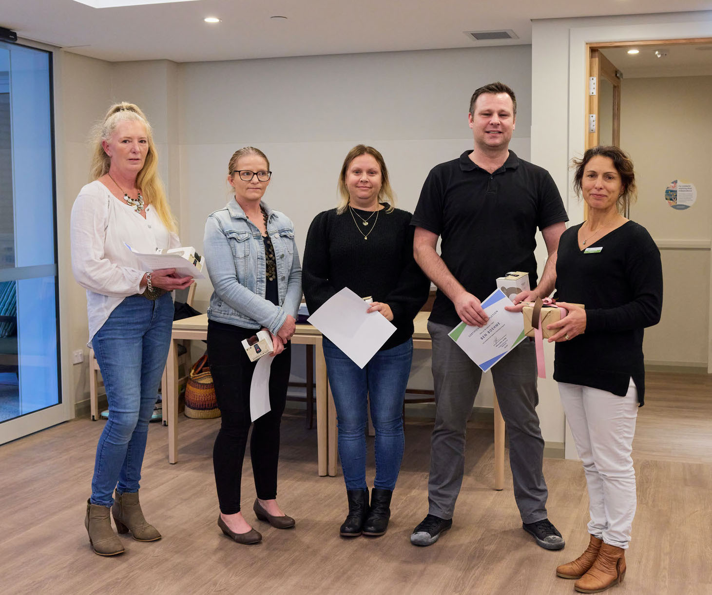 Group of 5 trainees with certificates
