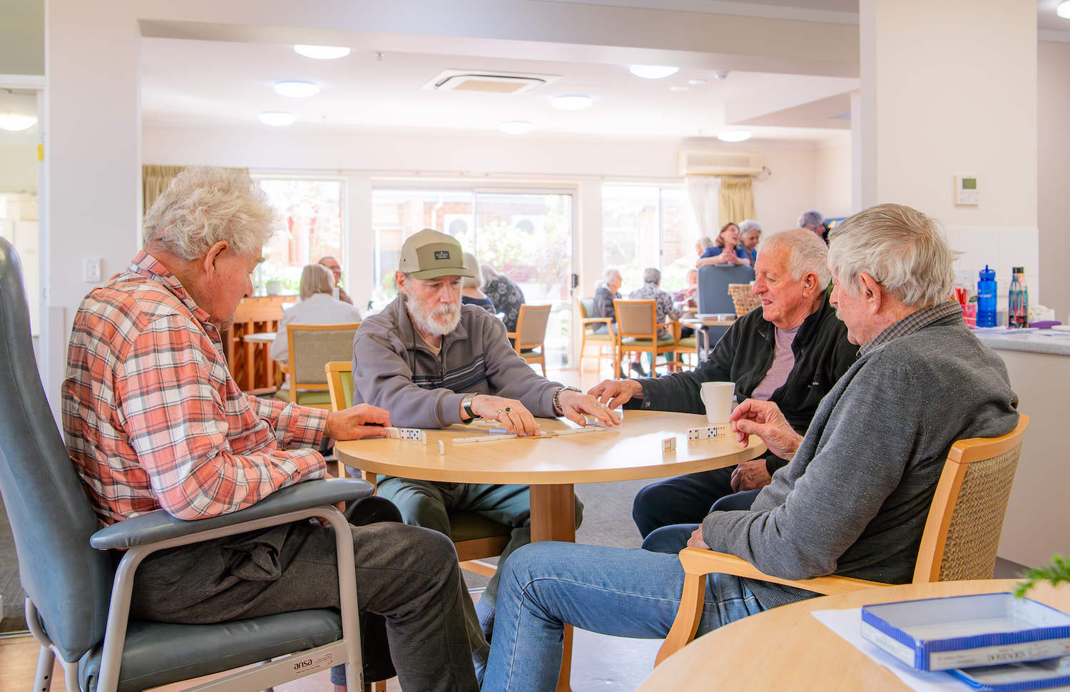Capecare respite residents playing dominos