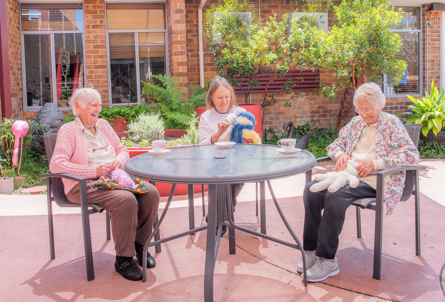 Capecare respite residents having tea outside