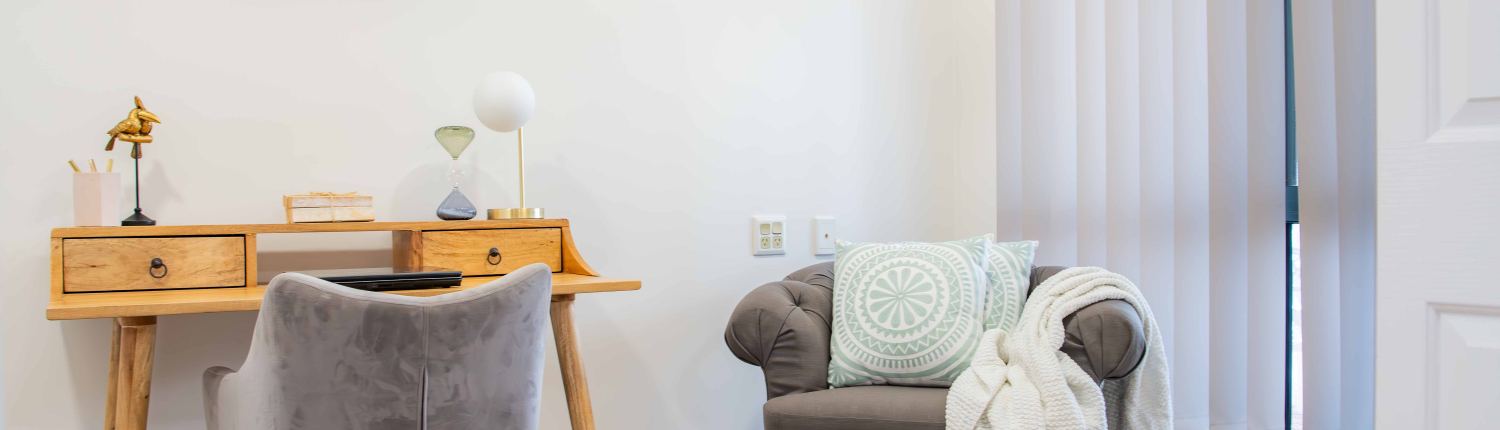 Desk and lounge chair in the study room of a retirement unit